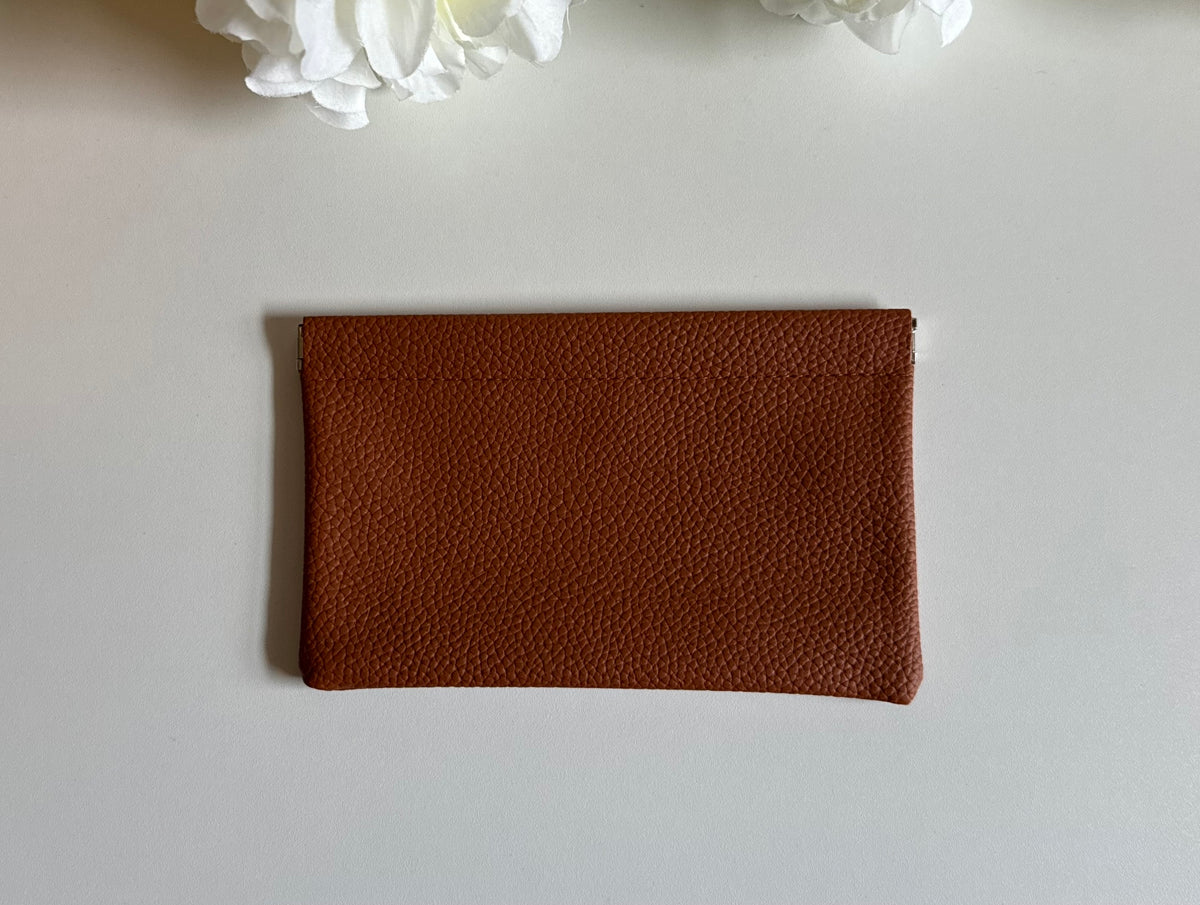 Brown Cash stuffing money pouch